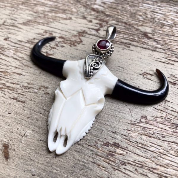Vintage carved bone cow skull pendant