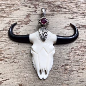 Vintage carved bone cow skull pendant