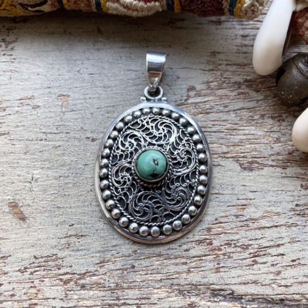 Vintage ornate sterling silver turquoise pendant