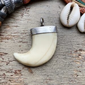 Vintage sterling silver carved claw pendant