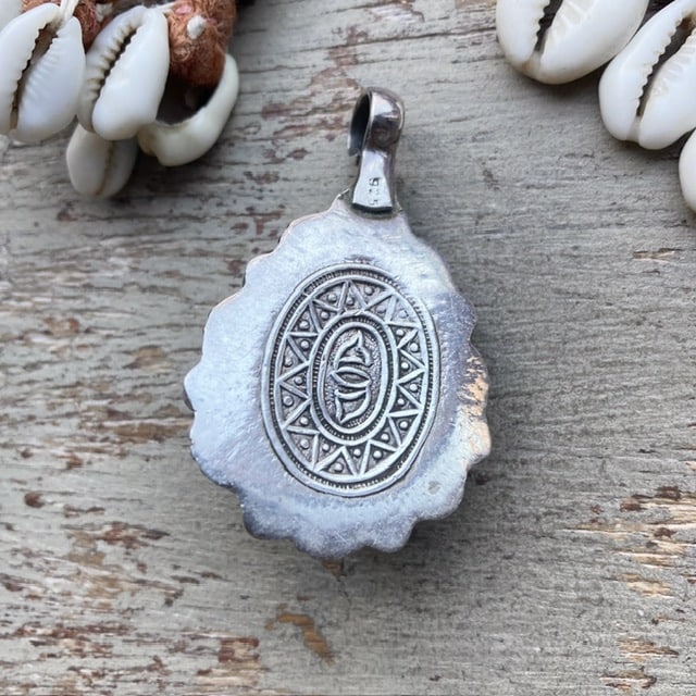 Vintage Tibetan sterling silver and coral pendant