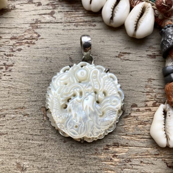 Vintage sterling silver carved mother of pearl pendant