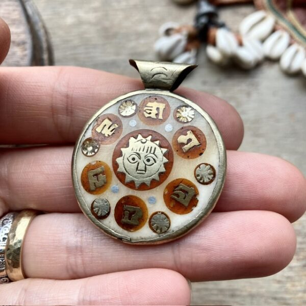 Vintage inlaid celestial pendant