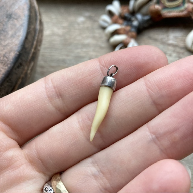 Vintage sterling silver carved bone pendant